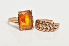 TWO YELLOW METAL RINGS, the first designed with a four claw set, rectangular cut citrine, textured