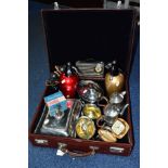 A BROWN LEATHER COVERED SUITCASE CONTAINING TWO SODA SYPHONS, SILVER PLATE AND PEWTER, ETC,