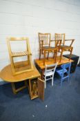AN OAK FINISH DROP LEAF KITCHEN TABLE containing fourfold away chairs, along with a pine table,