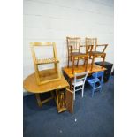 AN OAK FINISH DROP LEAF KITCHEN TABLE containing fourfold away chairs, along with a pine table,