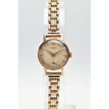 A LADYS 18CT GOLD 'UNIVERSAL GENEVE' WRISTWATCH, hand wound movement, round discoloured silver