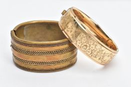 A ROLLED GOLD BANGLE AND ONE OTHER, the rolled gold bangle with a floral design to one side,