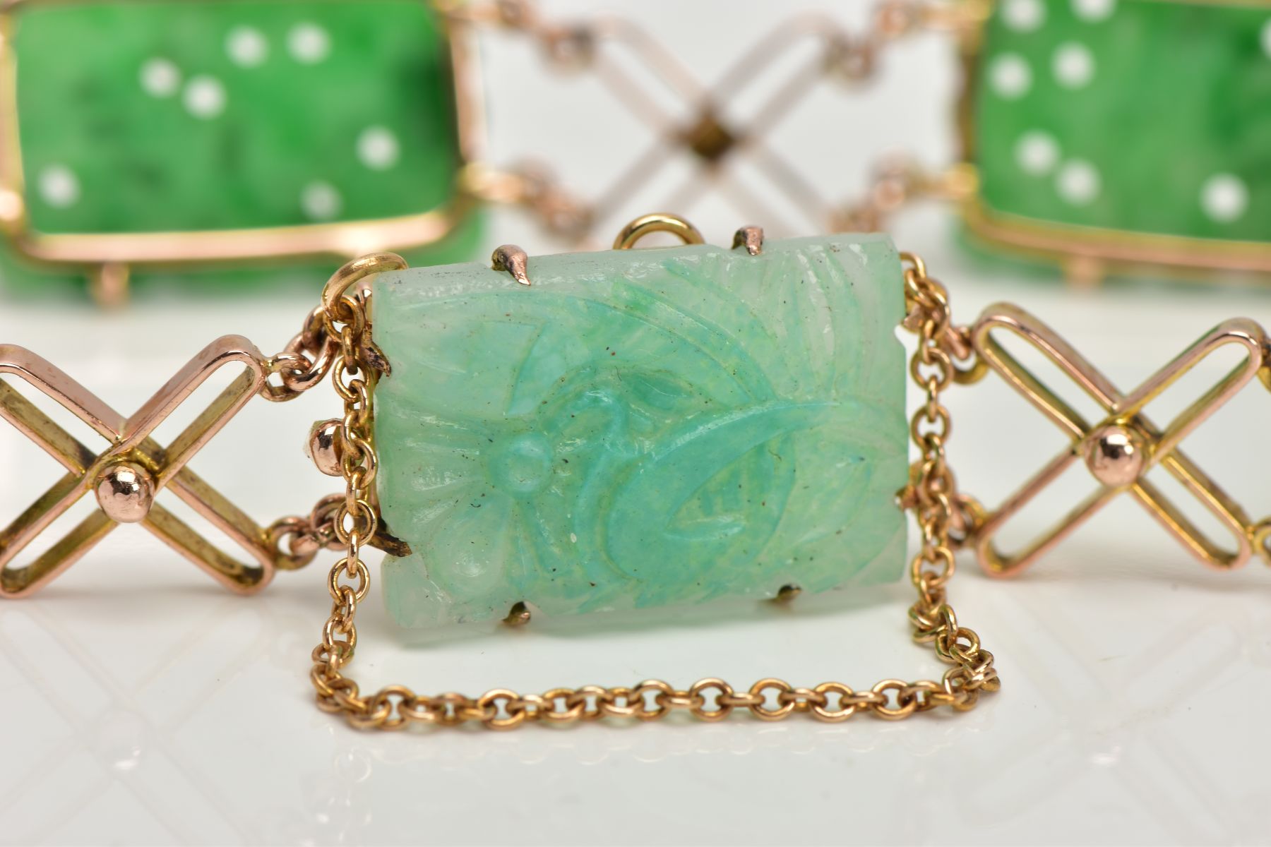 A JADEITE PANEL BRACELET, designed as four rectangular carved jadeite panels and one replacement - Image 3 of 6