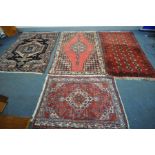 THREE WESTERN IRANIAN WOOLLEN RUGS, early to mid-20th century, largest rug size 197cm x 141cm, and a