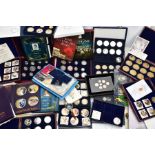 A LARGE PLASTIC BOX OF ASSORTED COINS, to include two fitted cases of silver proof UK one pound to