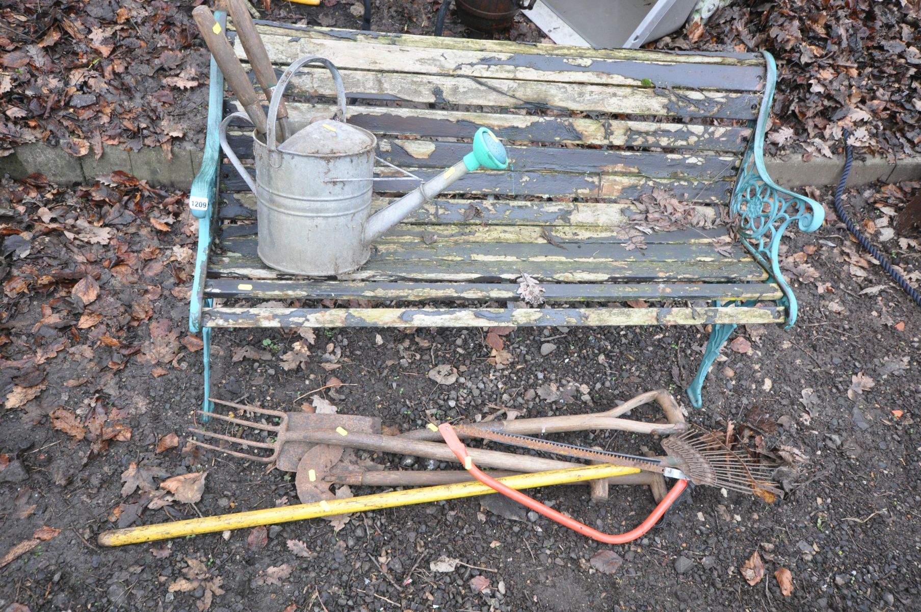 AN ALUMINIUM GARDEN BENCH with distressed slats, length 125cm, various garden hand tools and a