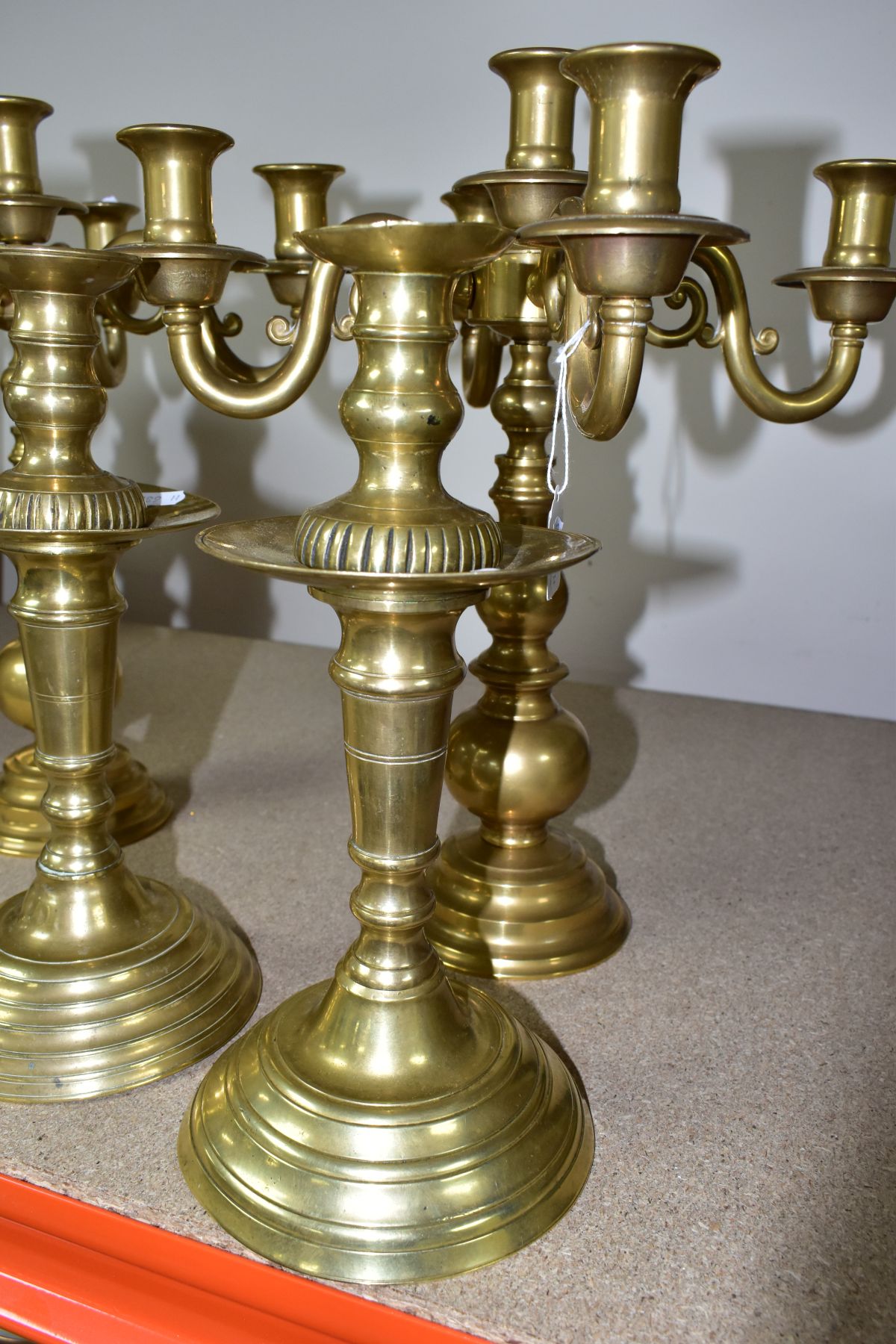 A PAIR OF MODERN BRASS FIVE BRANCH CANDELABRA AND A MATCHED PAIR OF BRASS CANDLESTICKS, the - Image 2 of 6