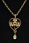 AN EDWARDIAN PERIDOT AND SEED PEARL PENDANT AND A 9CT GOLD CHAIN, the openwork heart shape pendant