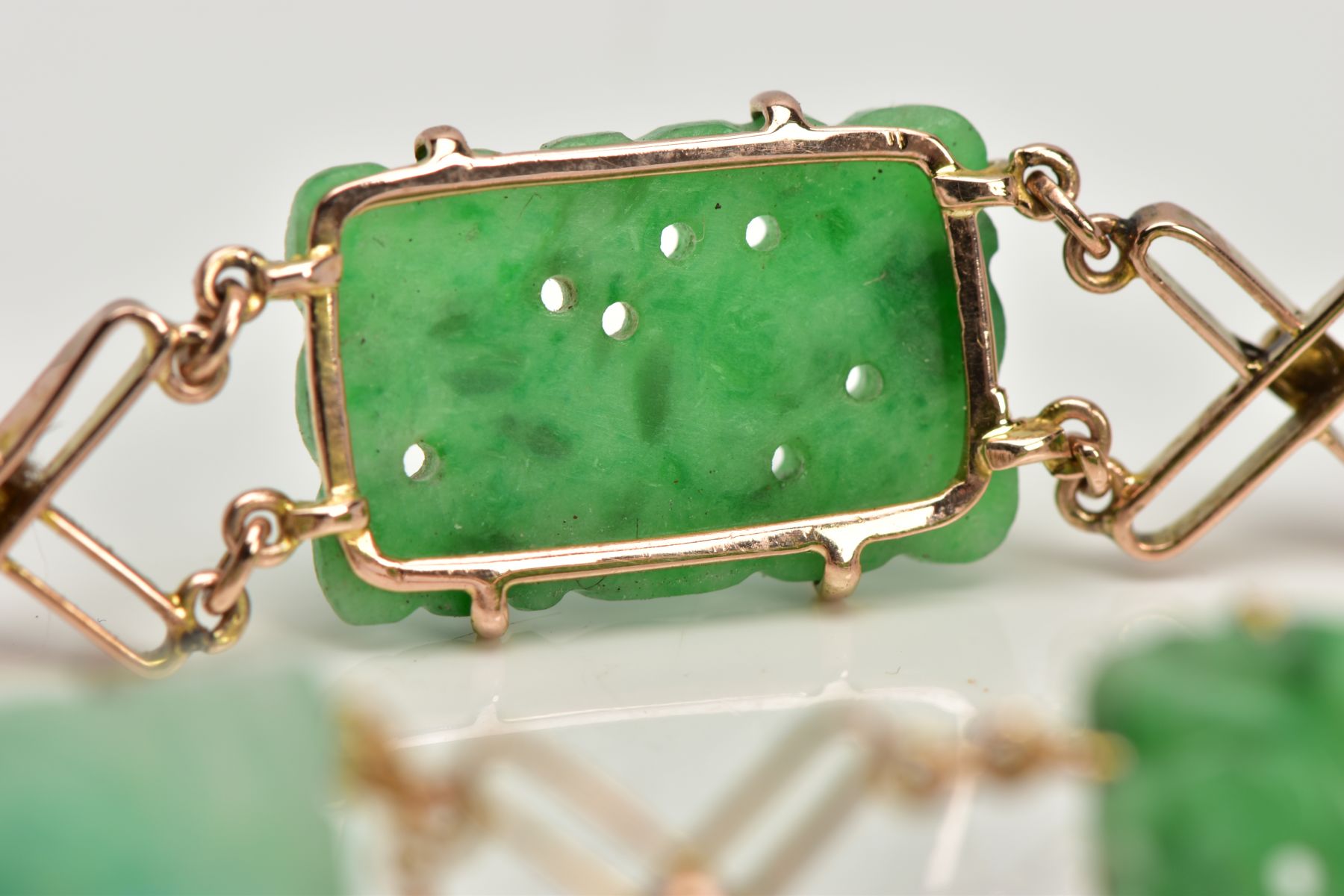 A JADEITE PANEL BRACELET, designed as four rectangular carved jadeite panels and one replacement - Image 6 of 6