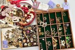 A QUANTITY OF ASSORTED COSTUME JEWELLERY, to include a wooden display case and a box comprising of