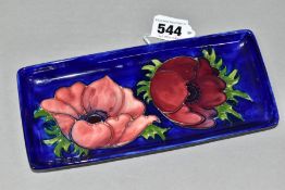 A MOORCROFT POTTERY ANENOME PATTERN TRAY, rectangular tray with tubelined red/purple anemones on a