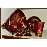 FIVE PIECES OF CARLTON WARE ROUGE ROYALE, comprising a triangular dish in the Heron and Magical Tree