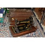 A VINTAGE SINGER SEWING MACHINE, in fitted oak case, approximate length 46cm, width 23.5cm, height