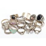 A SELECTION OF WHITE METAL RINGS, eighteen rings in total, of various styles and designs, fourteen