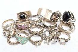 A SELECTION OF WHITE METAL RINGS, eighteen rings in total, of various styles and designs, fourteen