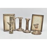 A SELECTION OF SILVER AND WHITE METAL ITEMS, to include a pair of embossed candlesticks, decorated