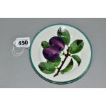 A WEMYSS TEA PLATE DECORATED WITH PURPLE PLUMS ON A BRANCH PATTERN, green line rim, incised