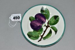 A WEMYSS TEA PLATE DECORATED WITH PURPLE PLUMS ON A BRANCH PATTERN, green line rim, incised