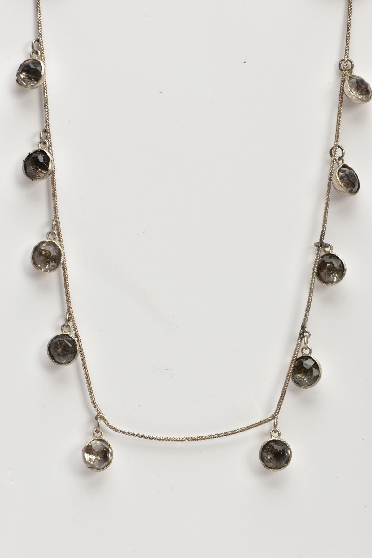 A WHITE METAL AND PASTE NECKLACE, designed as ten old cut paste stones each in a bezel domed back - Image 4 of 7