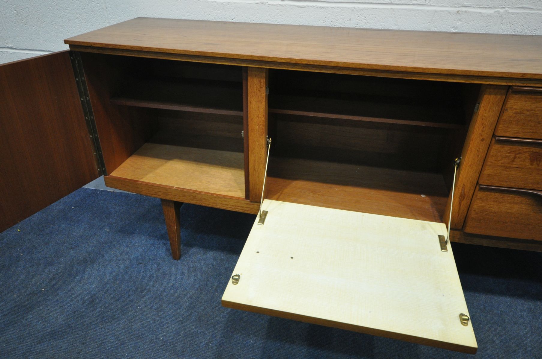 A MID CENTURY BEAUTILITY TEAK SIDEBOARD, with double cupboard doors, besides three drawers, - Image 2 of 3