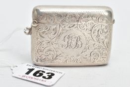 A SILVER VESTA CASE, of a rounded rectangular form, engraved foliate design, centring on an engraved