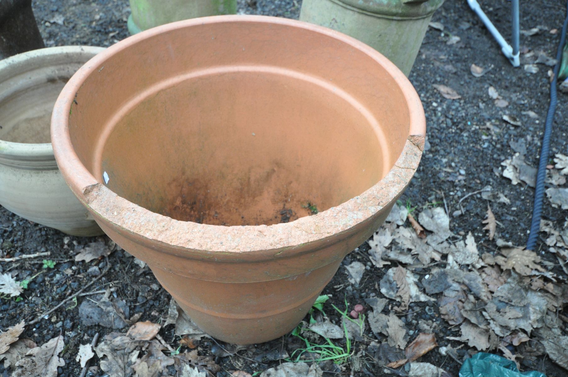 A PAIR CLAY CHIMNEY POTS, diameter 34cm x height 81cm, a terracotta circular planter (some damage to - Image 4 of 4