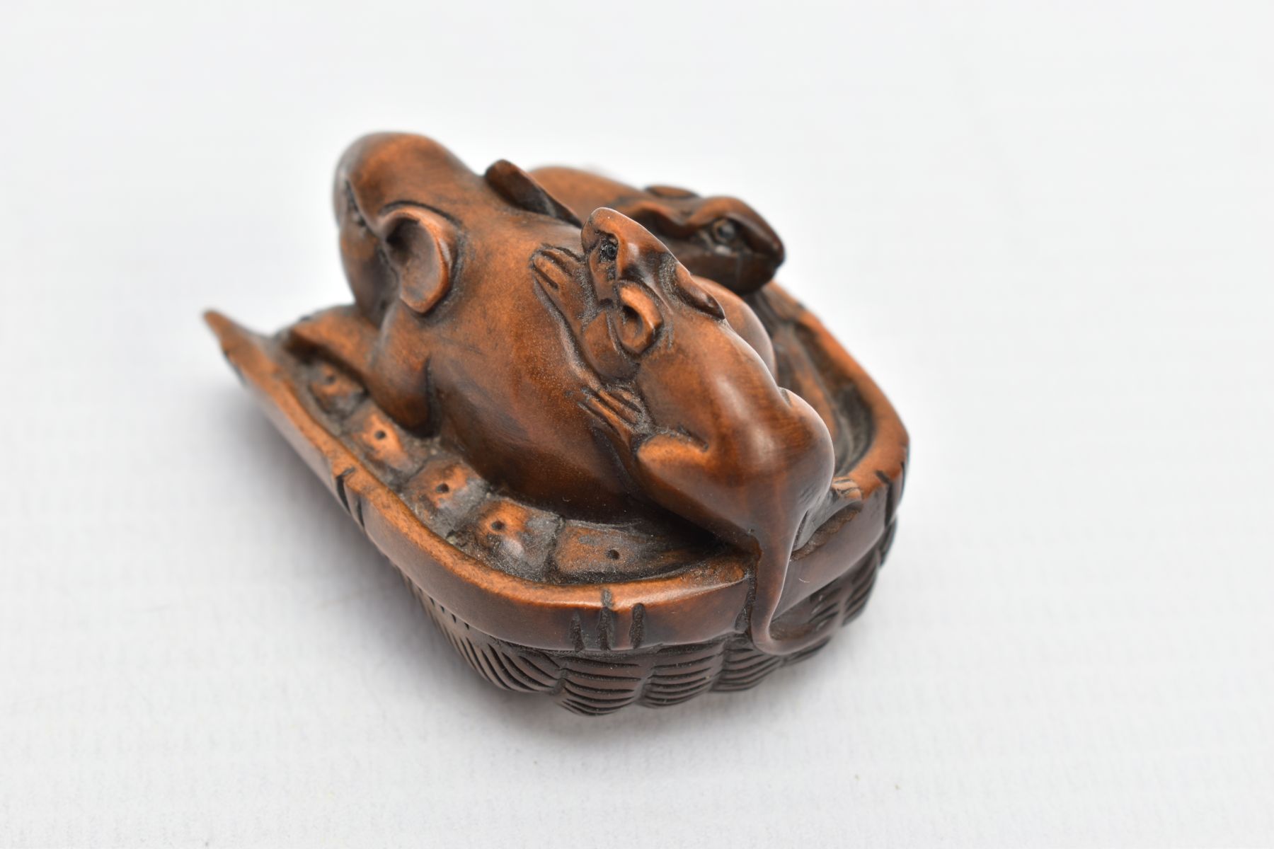 A CHINESE WOODEN NETSUKE, a small carved wooden netsuke depicting three mice in a basket, signed - Image 4 of 7