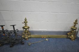 A PAIR OF BRASS ANDIRONS, with adjoining fender, a pair of wrought iron andirons, and a fire