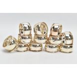 A SET OF TWELVE SILVER NAPKIN RINGS, each of a plain polished design, hallmarked 'C Ltd'