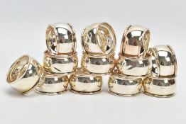 A SET OF TWELVE SILVER NAPKIN RINGS, each of a plain polished design, hallmarked 'C Ltd'