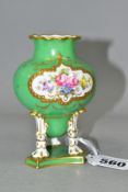 A ROYAL CROWN DERBY SQUAT BALUSTER VASE, with inverted dome between three legs standing on a plinth,