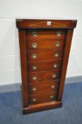 A REPRODUCTION MAHOGANY CAMPAIGN WELLINGTON CHEST, of seven graduated drawer, with recessed circular