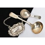 A SILVER SAUCE LADLE, CADDY SPOON AND A WHITE METAL DECANTER LABLE, Victorian fiddle pattern sauce