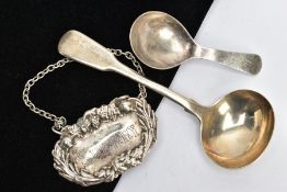 A SILVER SAUCE LADLE, CADDY SPOON AND A WHITE METAL DECANTER LABLE, Victorian fiddle pattern sauce