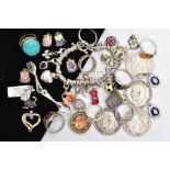 A BAG OF ASSORTED JEWELLERY AND COINS, to include a silver charm bracelet fitted with twelve