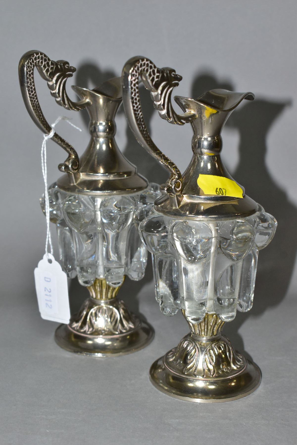 A PAIR OF DECORATIVE GLASS AND EPNS MINIATURE CLARET JUGS, the handles cast as mythical creatures, - Image 4 of 7