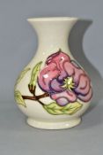 A LARGE MOORCROFT POTTERY BULBOUS VASE, with flared neck, decorated with tubelined pink Magnolia