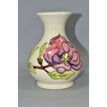 A LARGE MOORCROFT POTTERY BULBOUS VASE, with flared neck, decorated with tubelined pink Magnolia