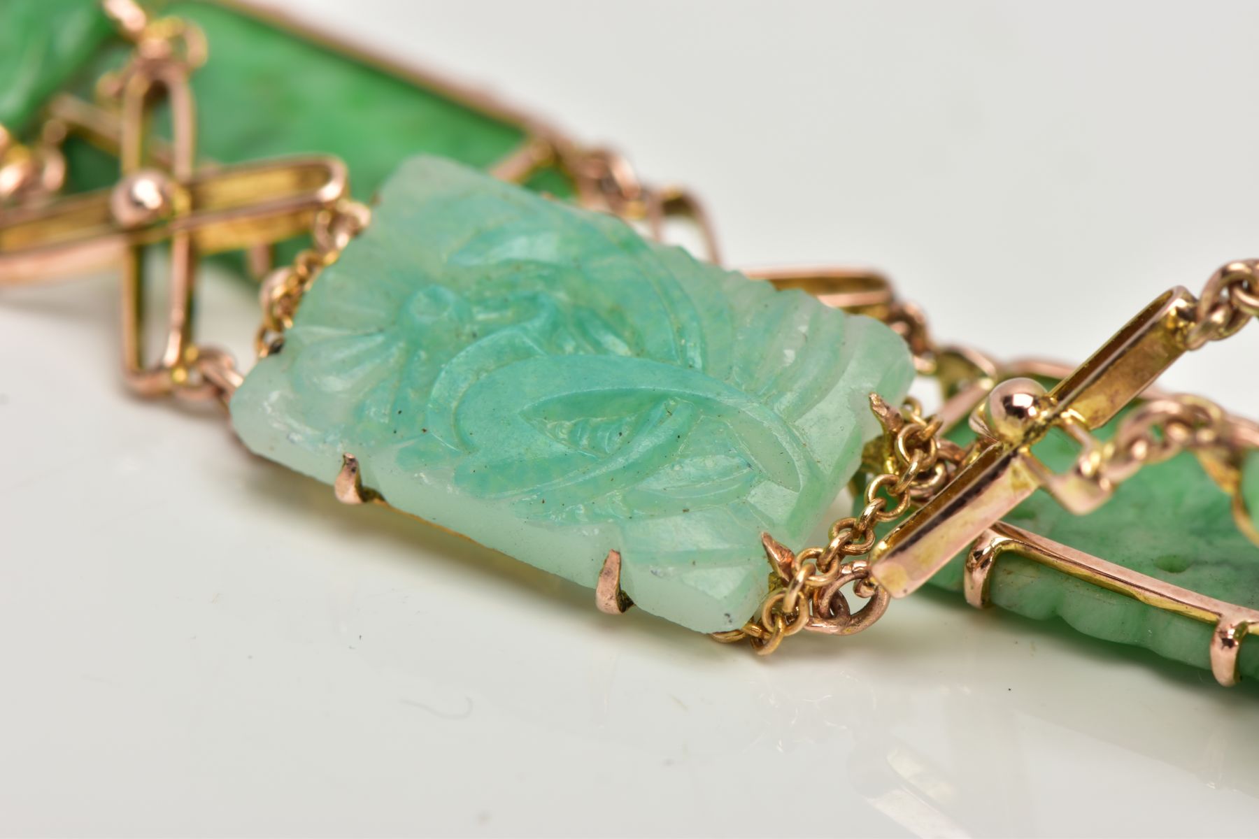 A JADEITE PANEL BRACELET, designed as four rectangular carved jadeite panels and one replacement - Image 5 of 6