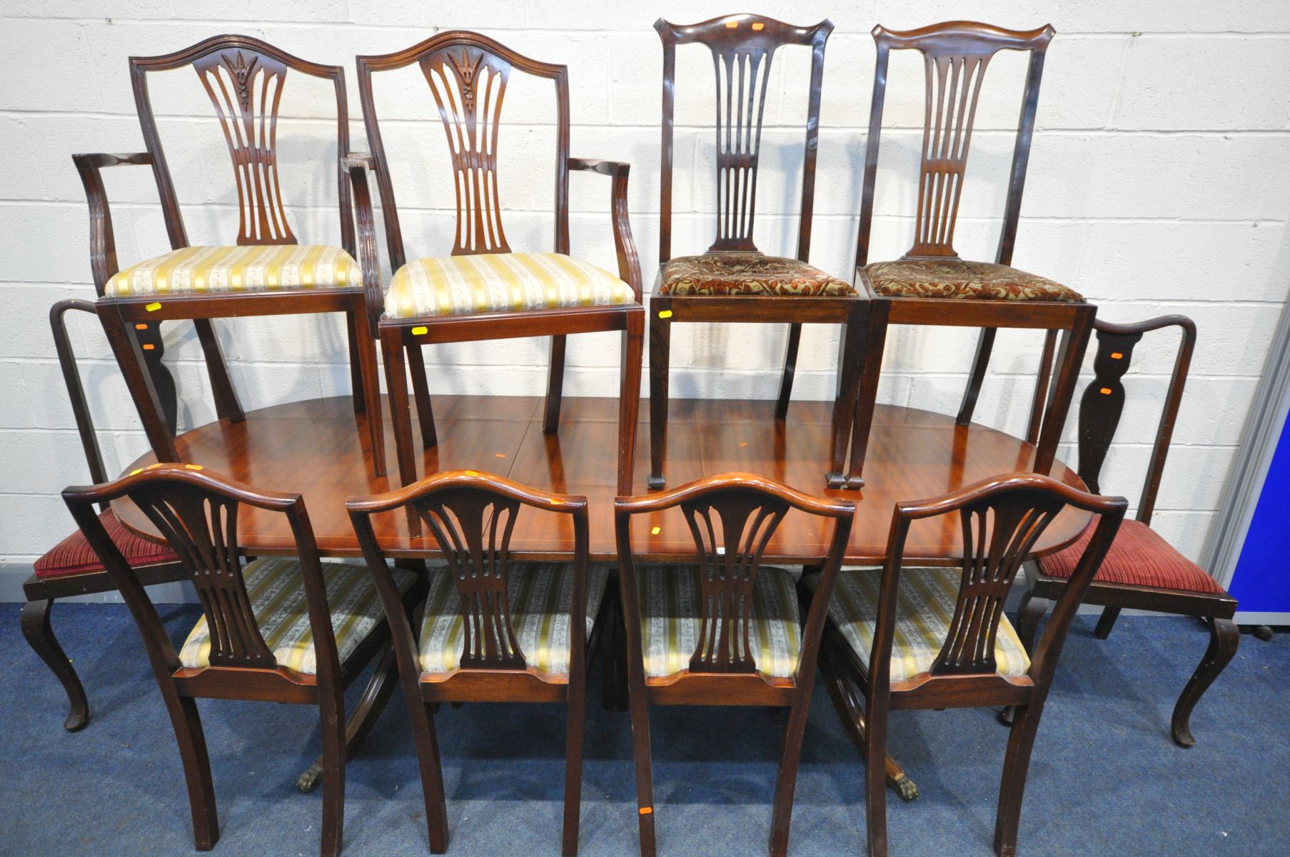 A MAHOGANY EXTENDING DINING TABLE, one additional leaf, extended length 228cm x closed length