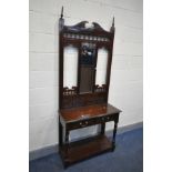 AN EDWARDIAN MAHOGANY HALL STAND, with a mirror back and two drawers, width 89cm x depth 39cm x