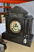A LATE VICTORIAN BLACK SLATE MANTEL CLOCK OF ARCHITECTURAL FORM, cracked and chipped case, damaged
