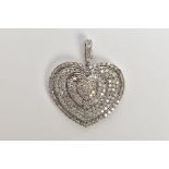 A DIAMOND HEART PENDANT, pave set diamond heart pendant, set with approximately 189 round