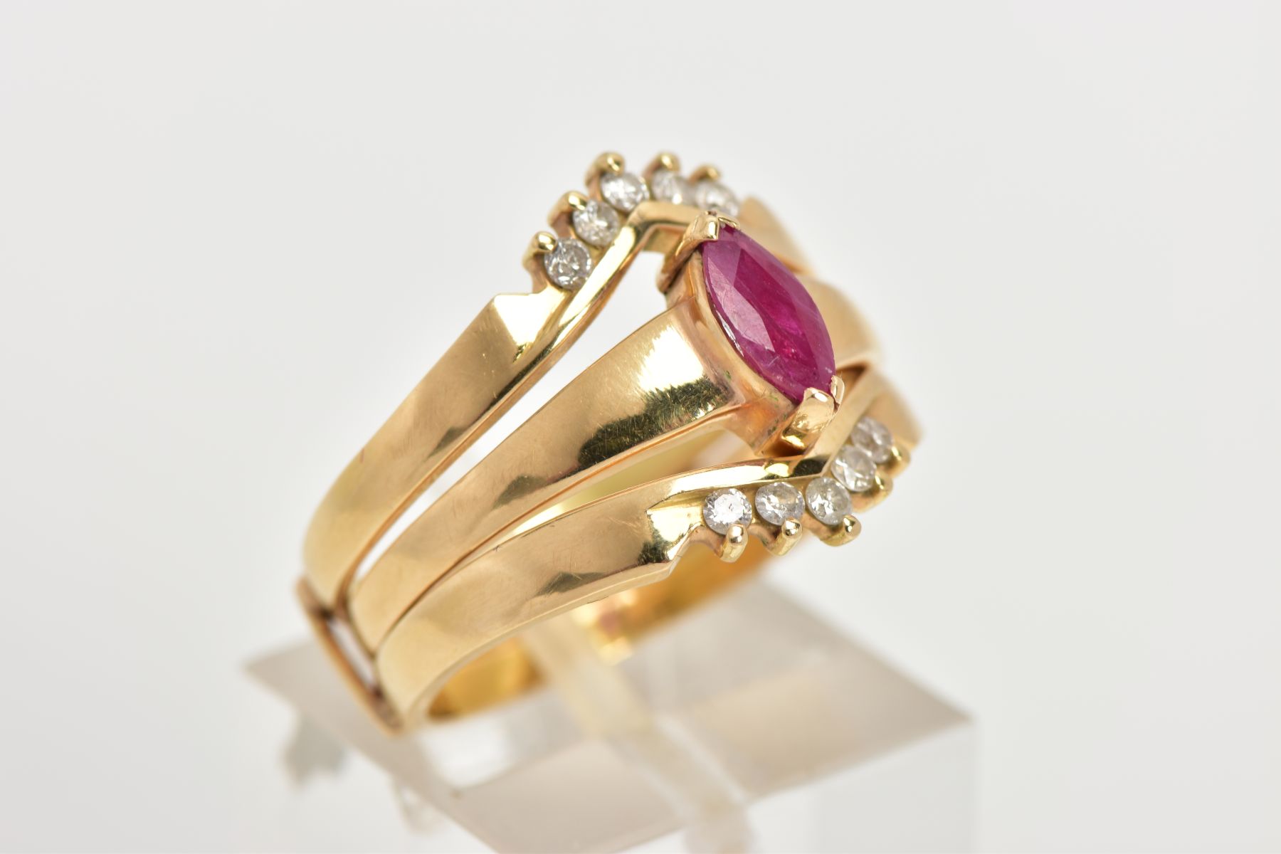 A YELLOW METAL RUBY AND DIAMOND PUZZLE RING, the centre ring designed with a tension set, marquise - Image 4 of 6