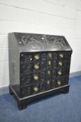 A 19TH CENTURY EBONISED BUREAU, signed to drawer 'Edwards and Roberts', decorated with acanthus