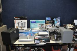 A BOXED SAINSBURYS SLOW COOKER, two boxed Tatung DVD recorders with remotes, a Philips DVD Video