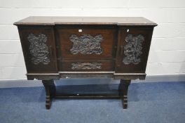 A CHINESE CARVED HARDWOOD FALL FRONT BUREAU on trestle stand with letter cubbies, small drawer