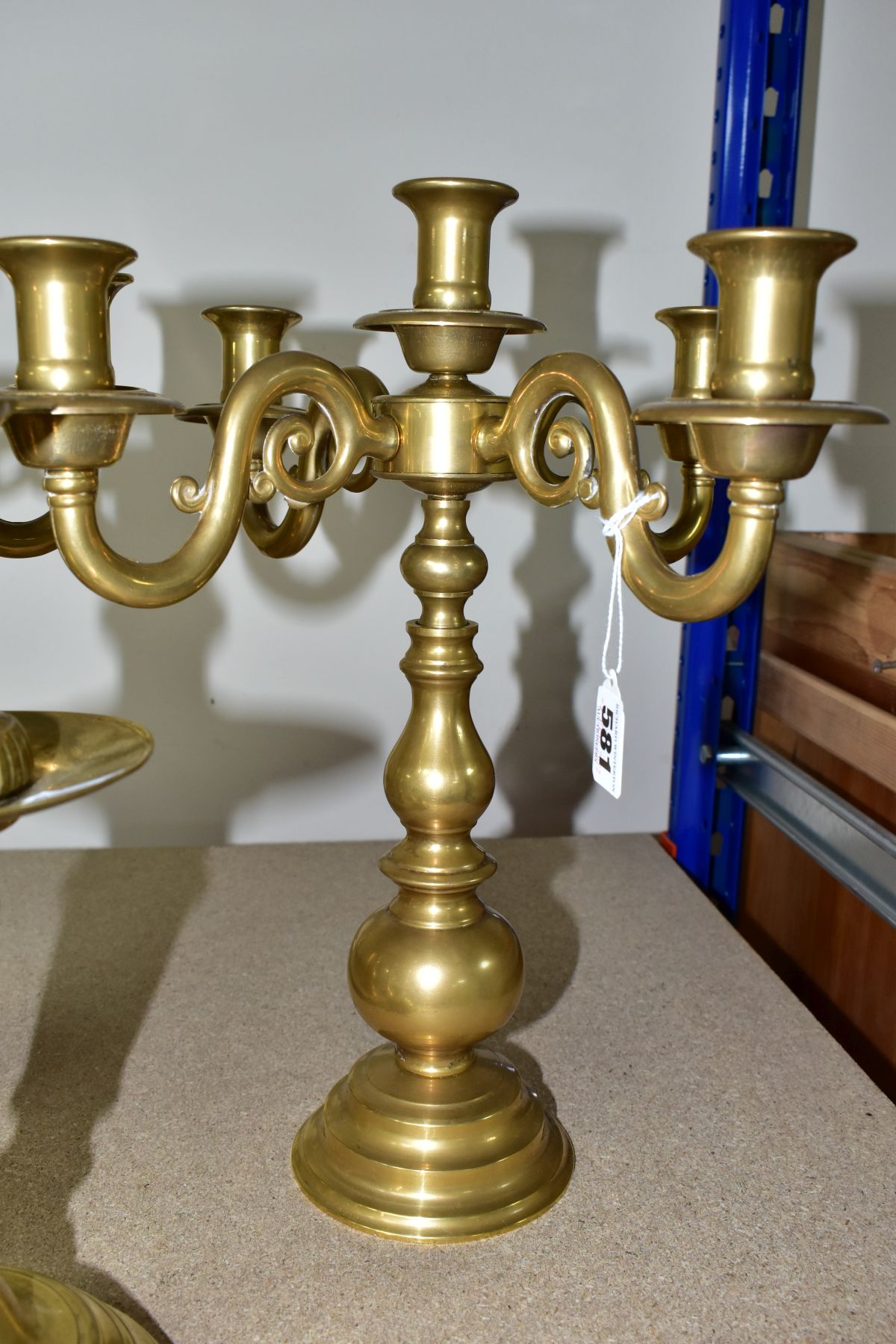 A PAIR OF MODERN BRASS FIVE BRANCH CANDELABRA AND A MATCHED PAIR OF BRASS CANDLESTICKS, the - Image 5 of 6
