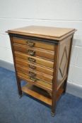 AN EDWARDIAN WALNUT SIX DRAWER MUSIC CABINET, width 52cm x depth 38cm x height 78cm