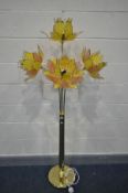 A BRASSED STANDARD LAMP, with four glass tulip shaped shades, height 168cm